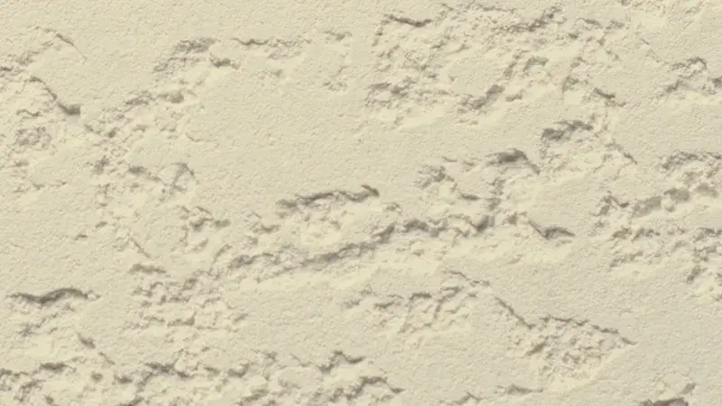 Coarse Coat stucco finish — close-up of the texture on a sample board