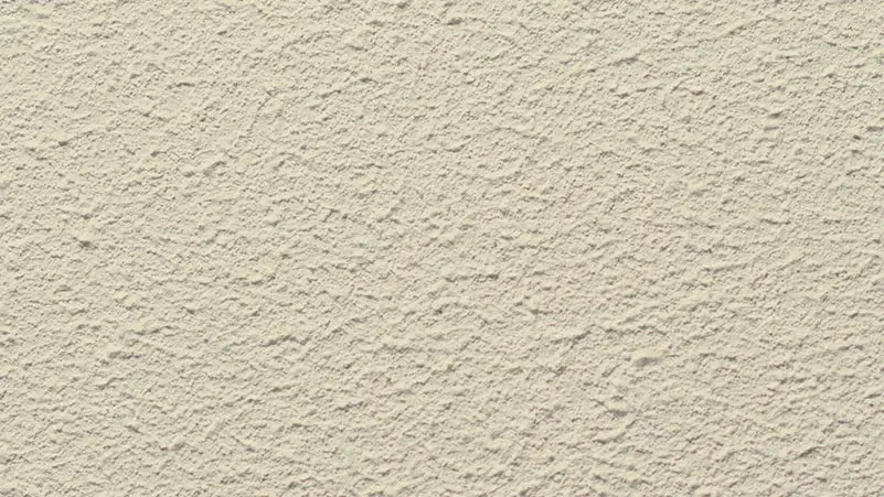 Roll-On stucco finish — close-up of the texture on a sample board