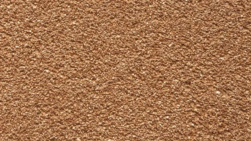 Shimmer Stone stucco finish — close-up of the texture on a sample board